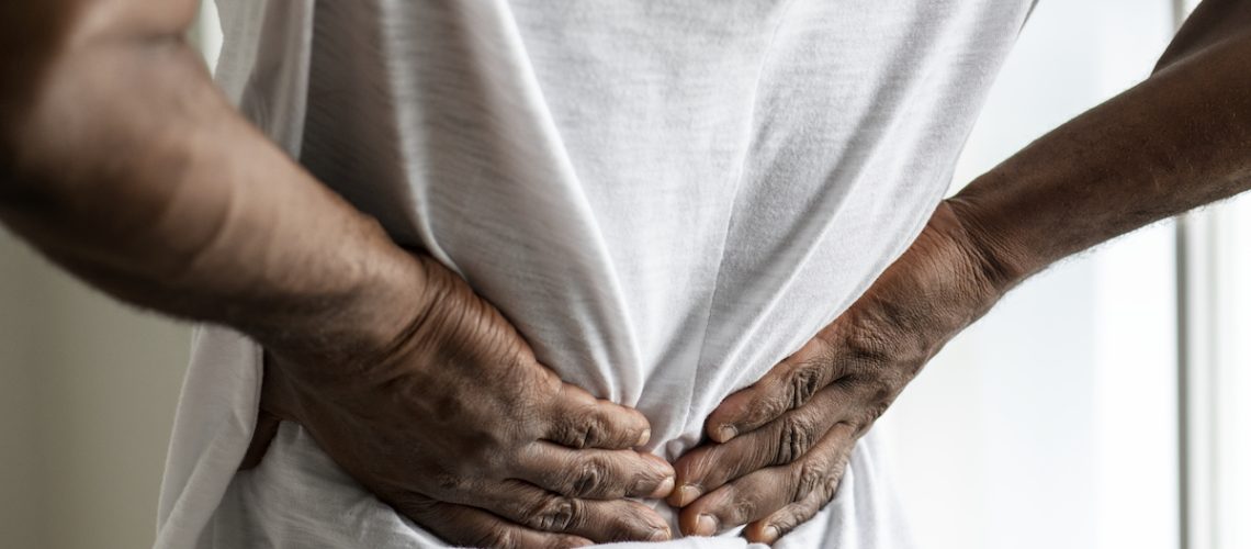 Black man suffering back pain